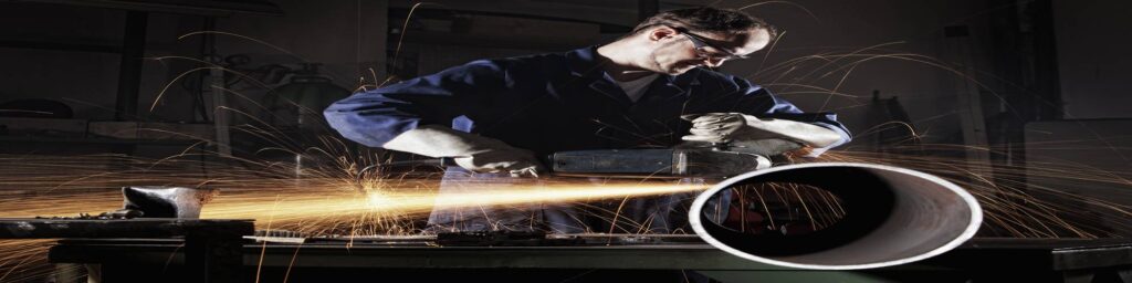 Man sawing metal